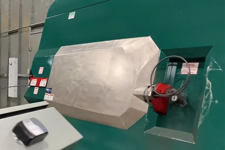 The bending head and guard on the face of a stirrup bender.