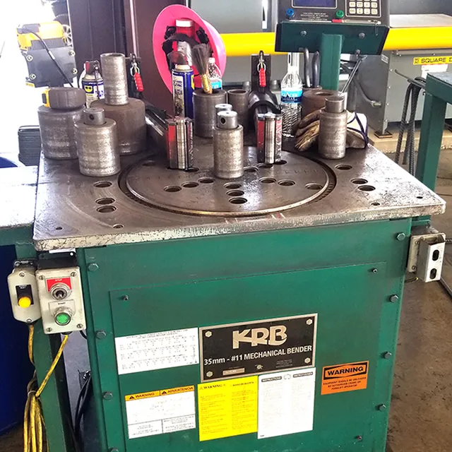 A KRB 35mm number 11 mechanical bender with bending tooling on its table.